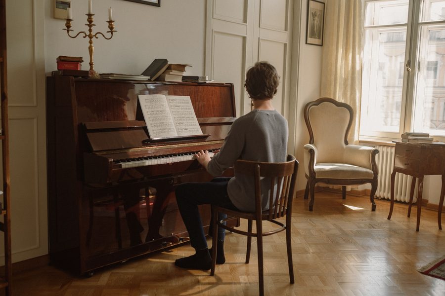 A self-playing piano playing in a living room